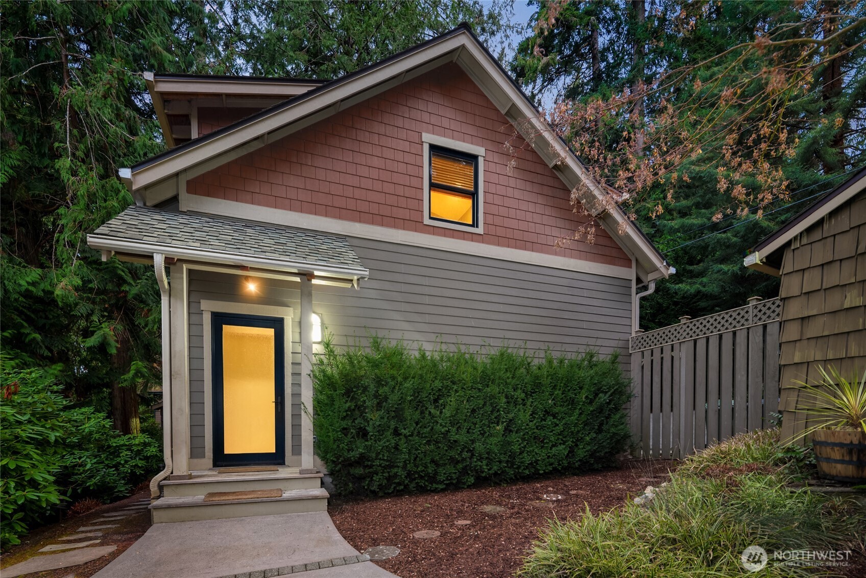 15550 Sandy Hook Road Northeast Poulsbo, WA 98370 - Photo 28 of 40 a front view of house with trees