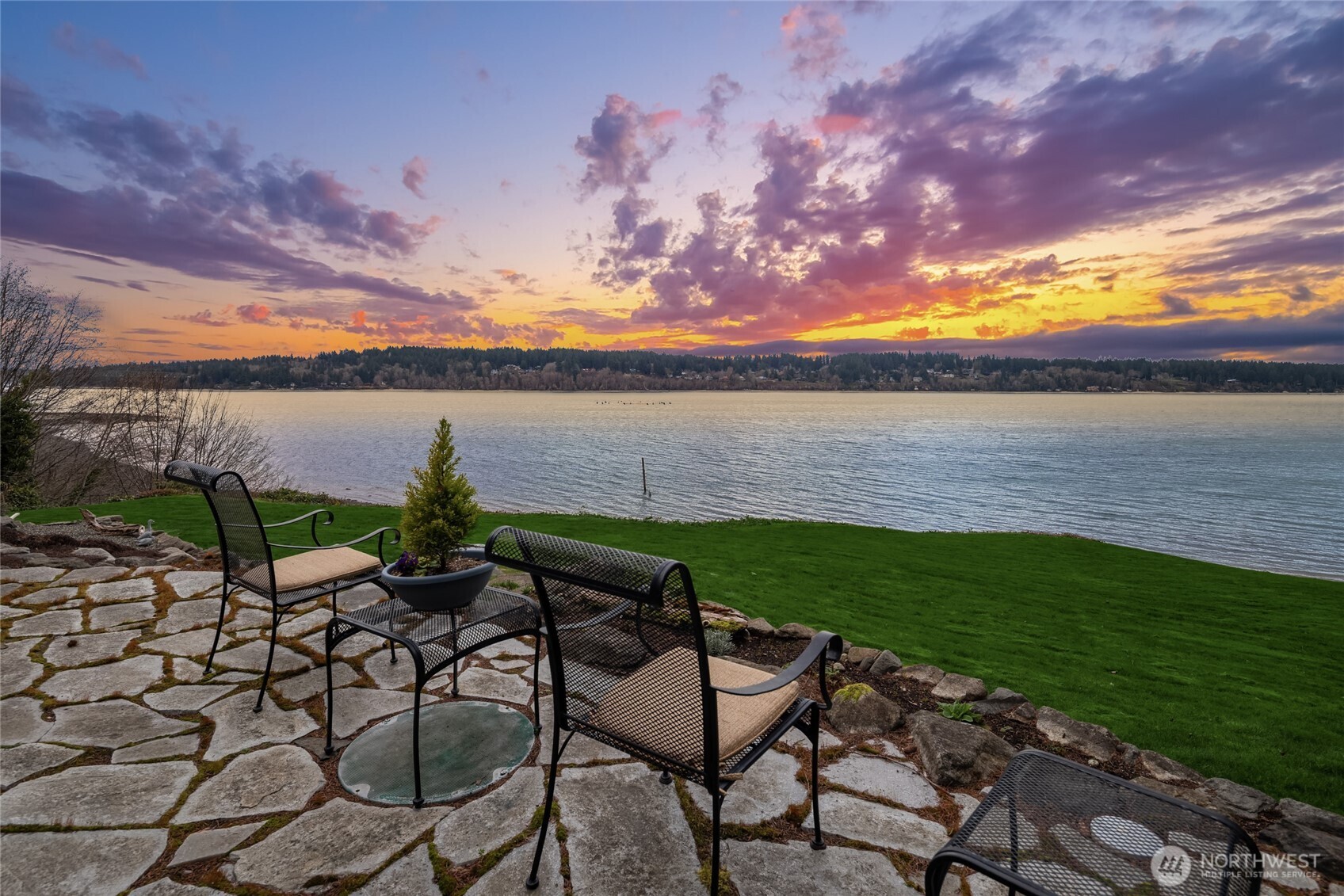 15550 Sandy Hook Road Northeast Poulsbo, WA 98370 - Photo 3 of 40 a view of a patio with chair and table