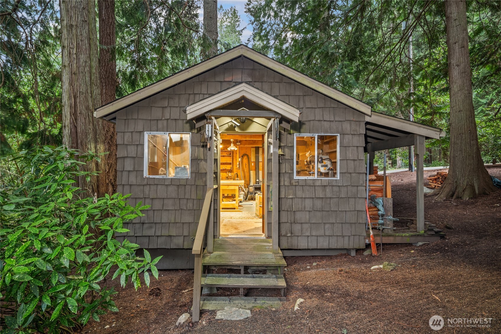 15550 Sandy Hook Road Northeast Poulsbo, WA 98370 - Photo 33 of 40 a front view of a house with a garage