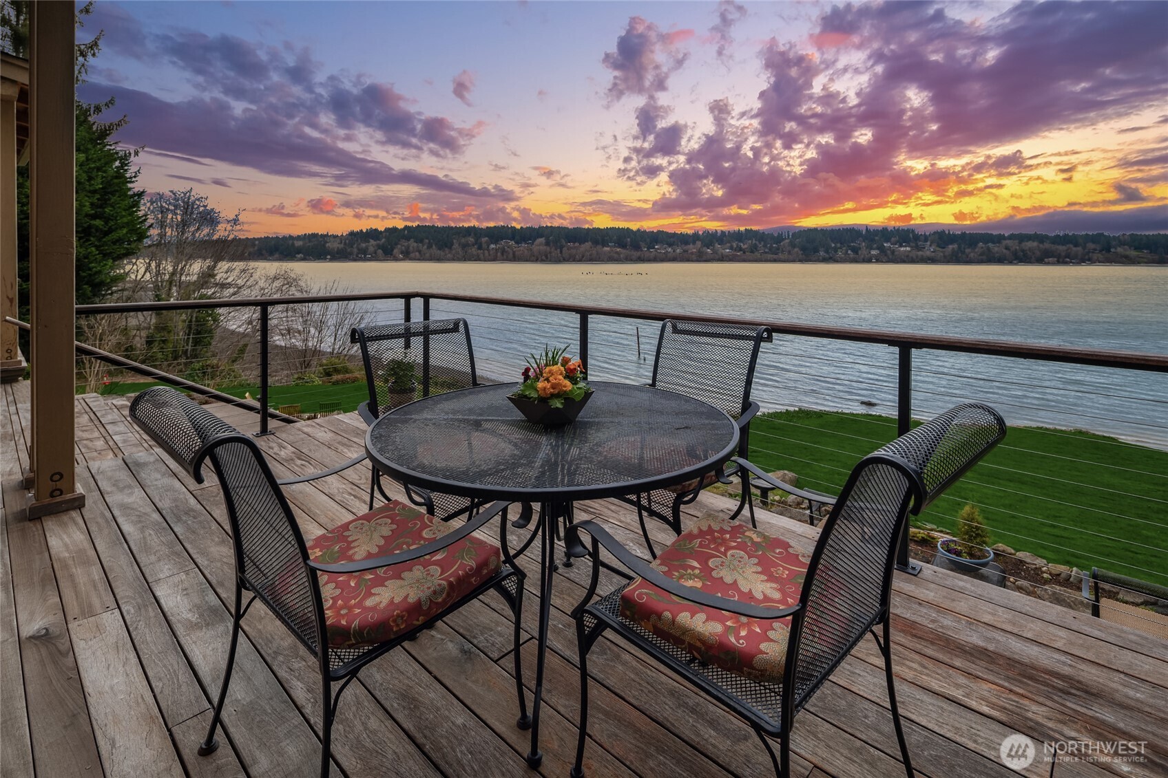 15550 Sandy Hook Road Northeast Poulsbo, WA 98370 - Photo 34 of 40 a view of a balcony with two chairs and a table