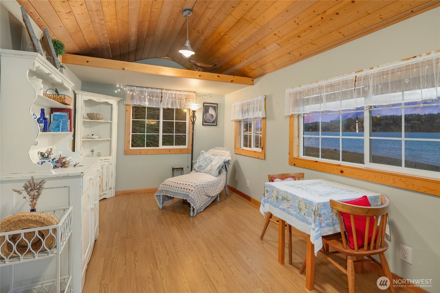 15550 Sandy Hook Road Northeast Poulsbo, WA 98370 - Photo 37 of 40 a living room with furniture and a large window
