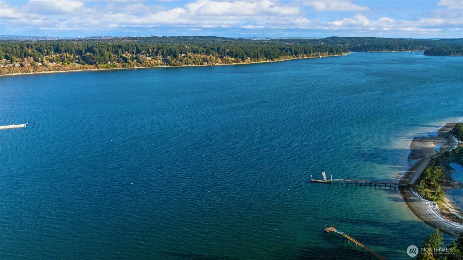 15550 Sandy Hook Road Northeast Poulsbo, WA 98370 - Photo 40 of 40 a view of a lake with a city