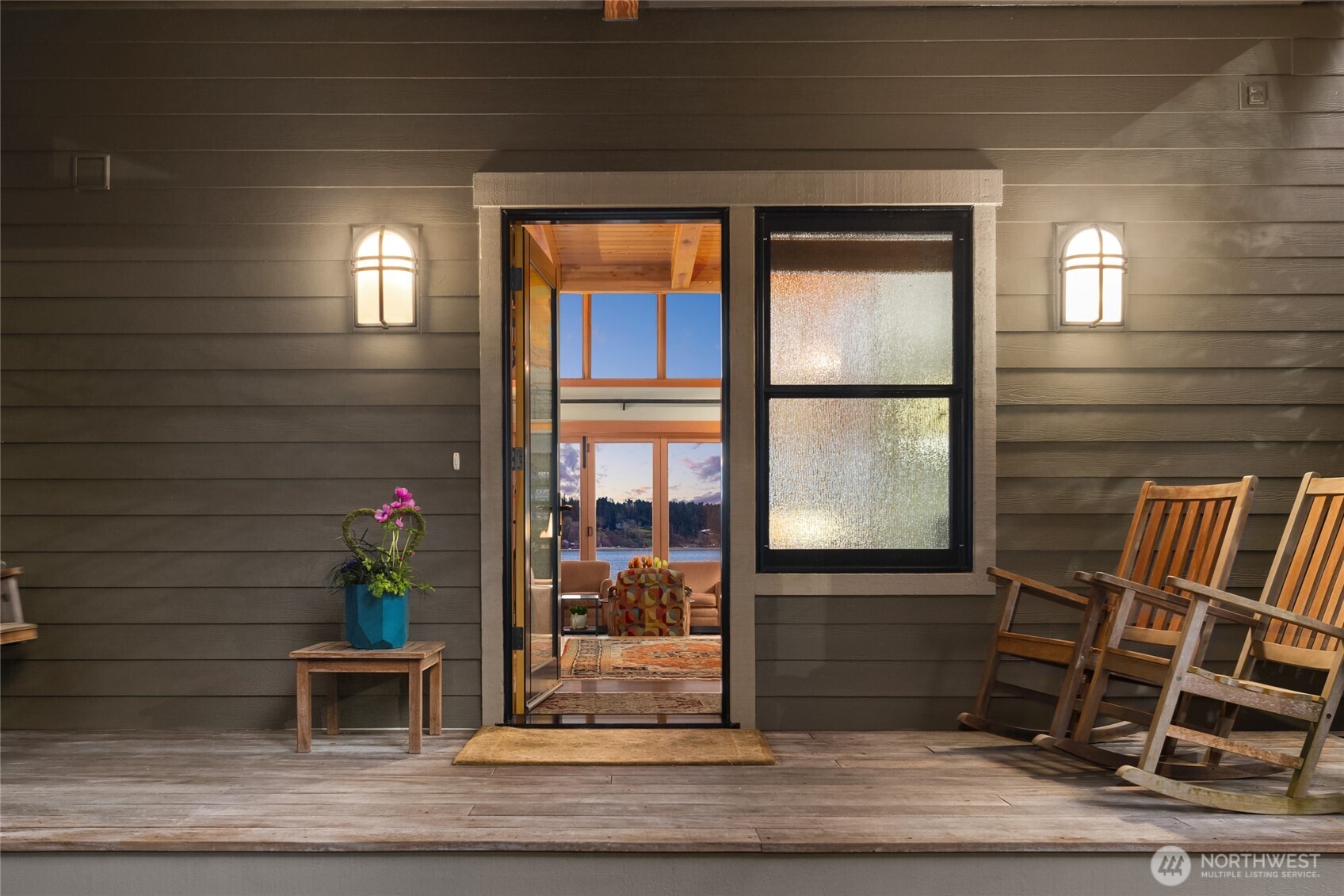 15550 Sandy Hook Road Northeast Poulsbo, WA 98370 - Photo 4 of 40 a potted plant sitting in front of a door