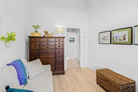 a bathroom with a granite countertop sink mirror vanity and toilet