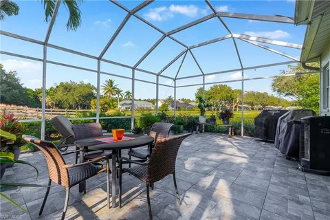 a view of a chairs and table in the patio