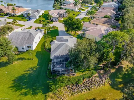 an aerial view of house with a yard