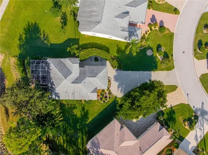 an aerial view of houses with yard
