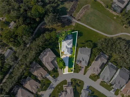 an aerial view of residential house with outdoor space