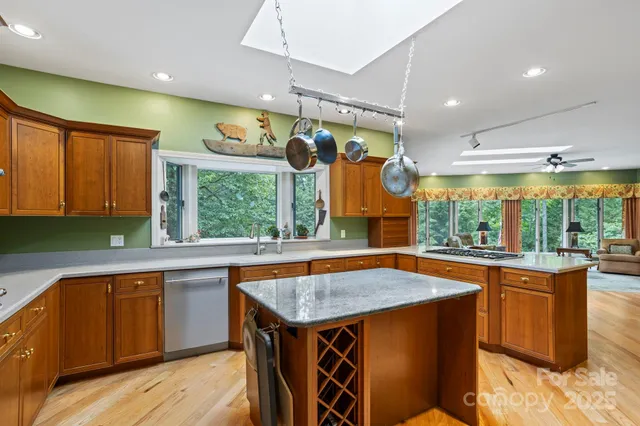 a kitchen with a sink window and cabinets