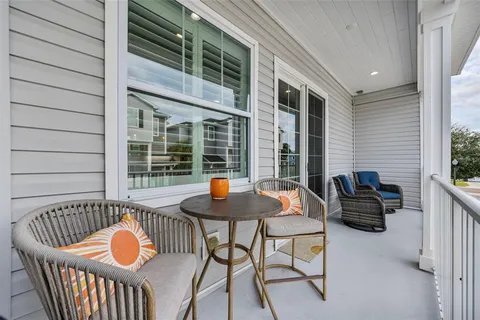a outdoor space with patio furniture and wooden floor