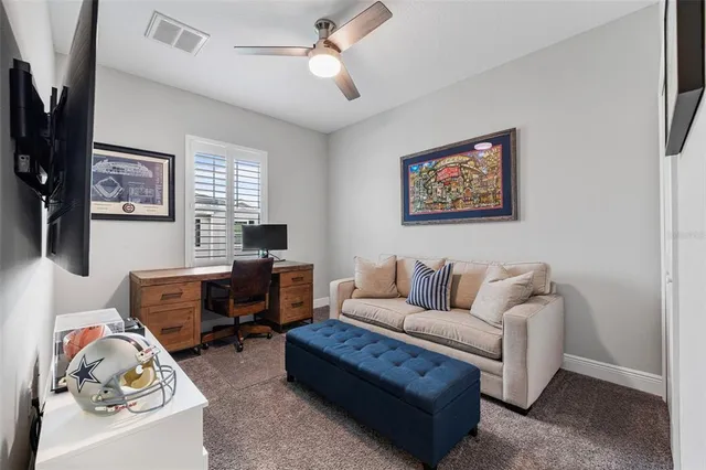 an aerial view of a house with pool table and chairs