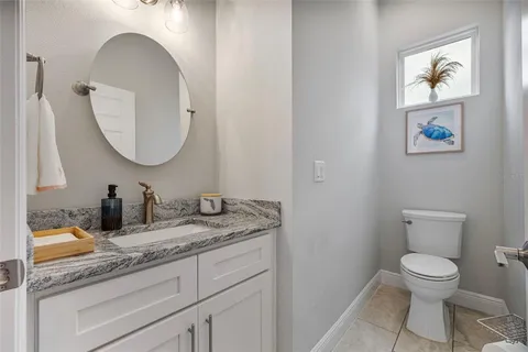 an aerial view of house with a swimming pool outdoor seating and yard