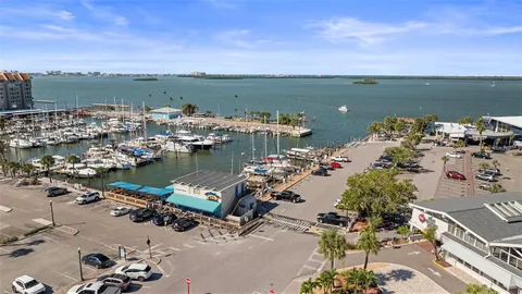 an aerial view of a house with pool table and chairs