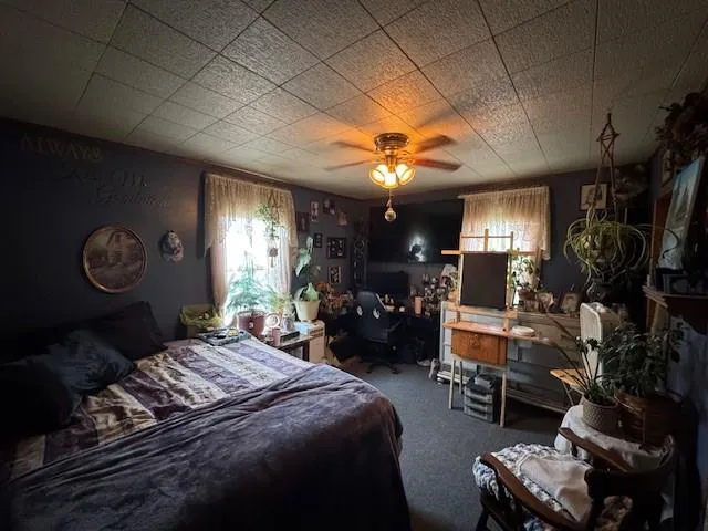 a bedroom with furniture and a window