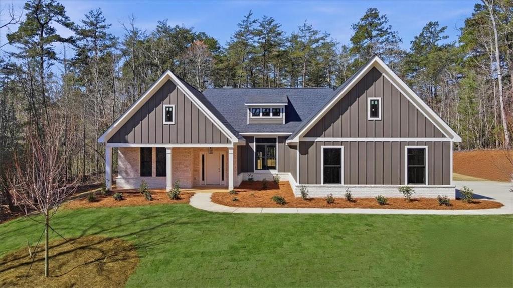 196 Red June Lane Clarkesville, GA 30523 - Photo 2 of 69 a front view of house with yard and green space