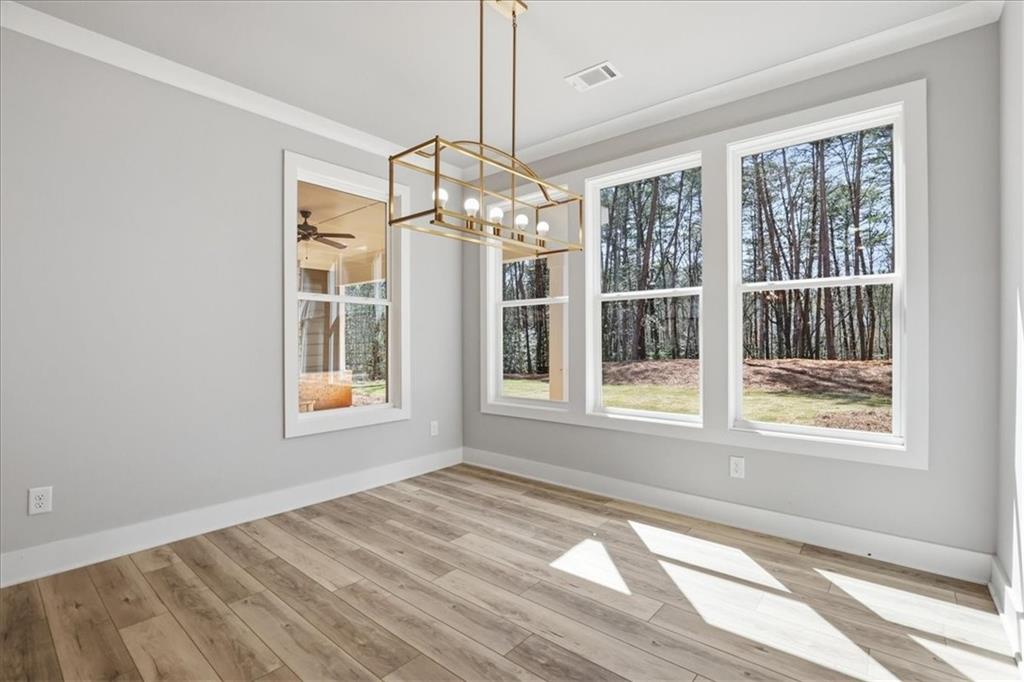 196 Red June Lane Clarkesville, GA 30523 - Photo 22 of 69 a view of an empty room with a window and chandelier