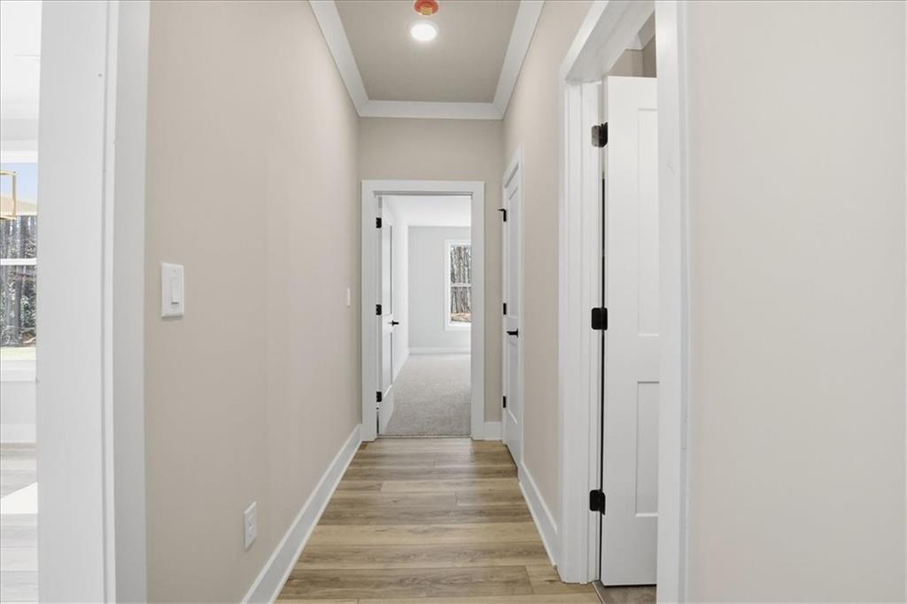 196 Red June Lane Clarkesville, GA 30523 - Photo 24 of 69 a view of a hallway with wooden floor