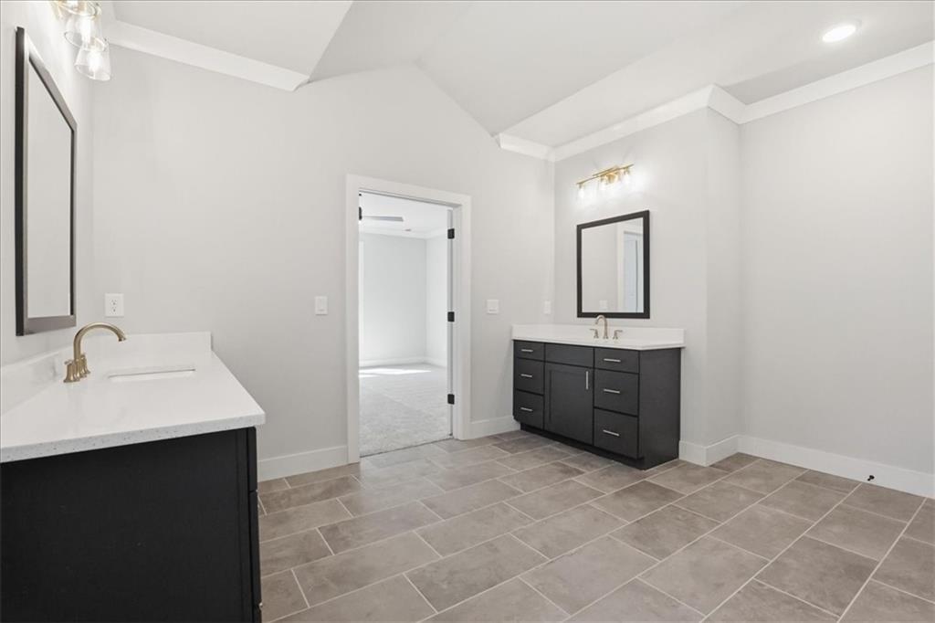196 Red June Lane Clarkesville, GA 30523 - Photo 38 of 69 a spacious bathroom with a sink a mirror and a vanity