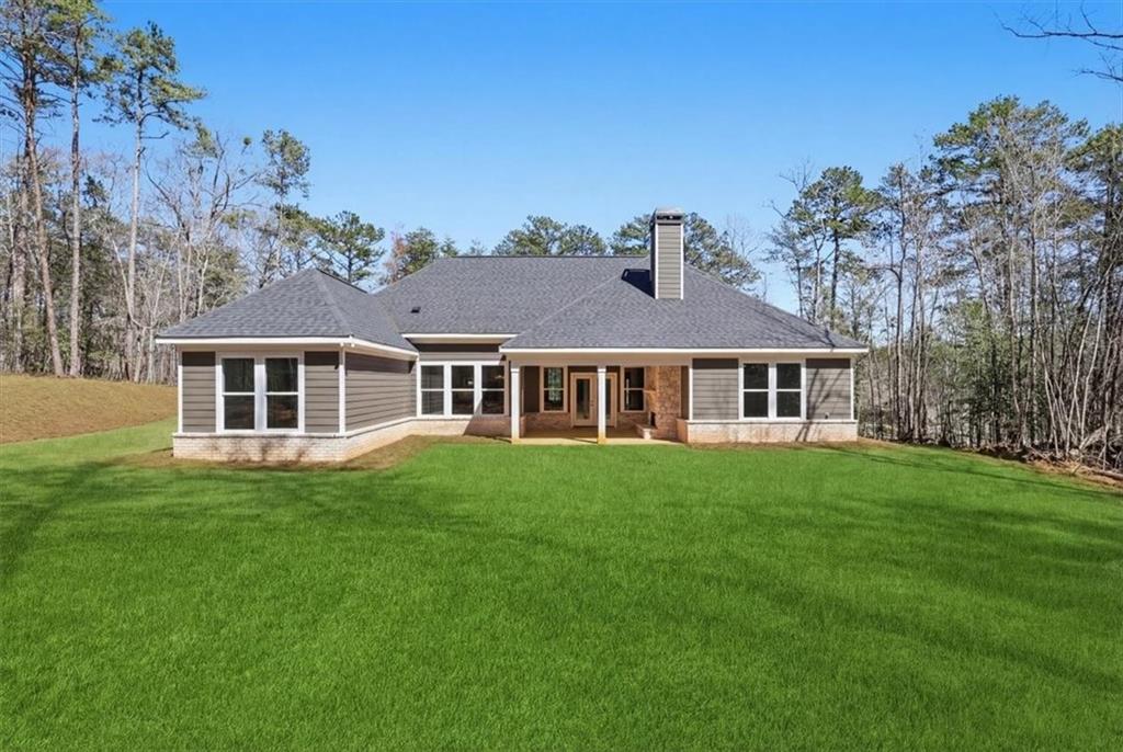 196 Red June Lane Clarkesville, GA 30523 - Photo 47 of 69 a front view of a house with a garden