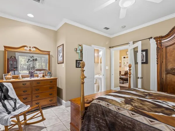 a bedroom with a large bed and a window