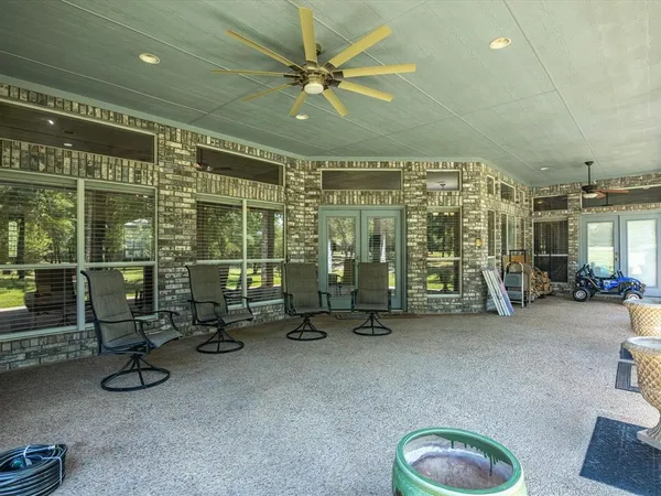a view of a house with a yard and sitting area