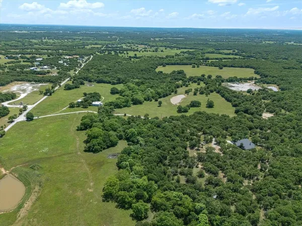 a kitchen with cabinets stainless steel appliances a sink and a window