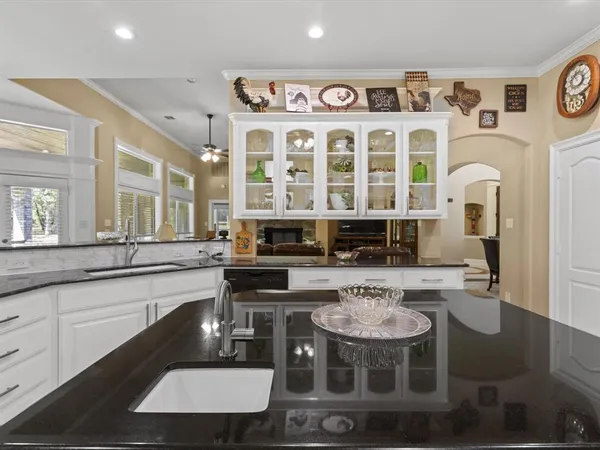 a kitchen with stainless steel appliances a stove a table and chairs