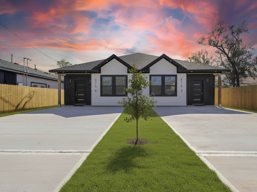 8216 Locksley Road, Unit B Houston, TX 77078 - Photo 1 of 15 a front view of a house with a yard and trees