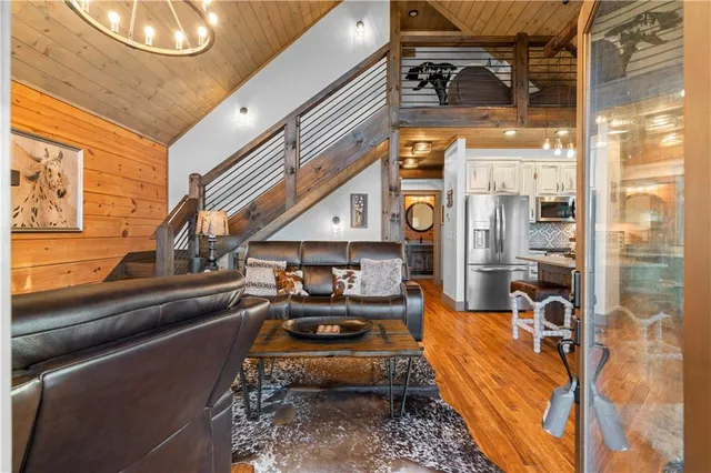 a kitchen with stainless steel appliances a stove a sink and a refrigerator