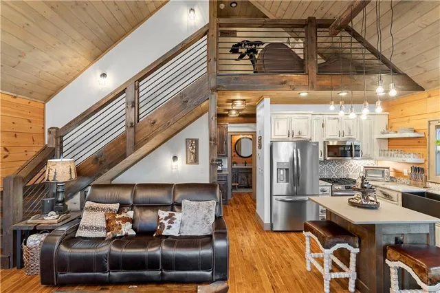 a kitchen with stainless steel appliances cabinets and a window