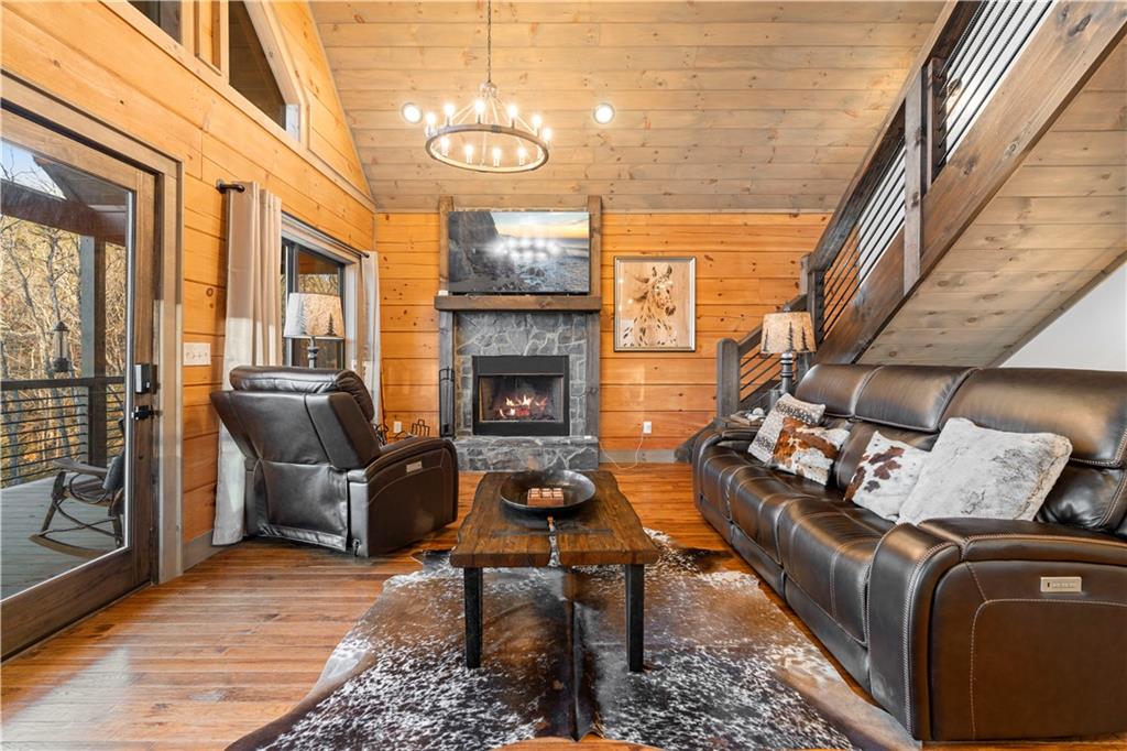447 Pig Trail Cherry Log, GA 30522 - Photo 17 of 71 a living room with furniture fireplace and a table