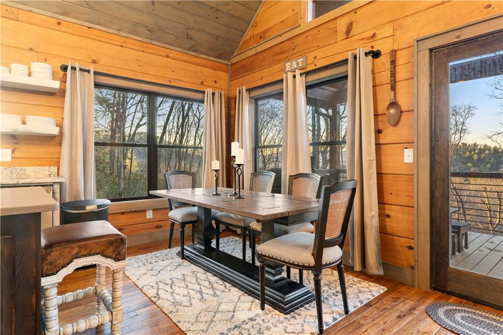 447 Pig Trail Cherry Log, GA 30522 - Photo 18 of 71 a dining room with furniture and wooden floor