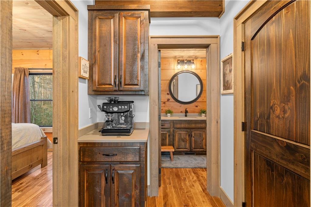 447 Pig Trail Cherry Log, GA 30522 - Photo 24 of 71 a kitchen with a refrigerator a stove and a sink with wooden floor