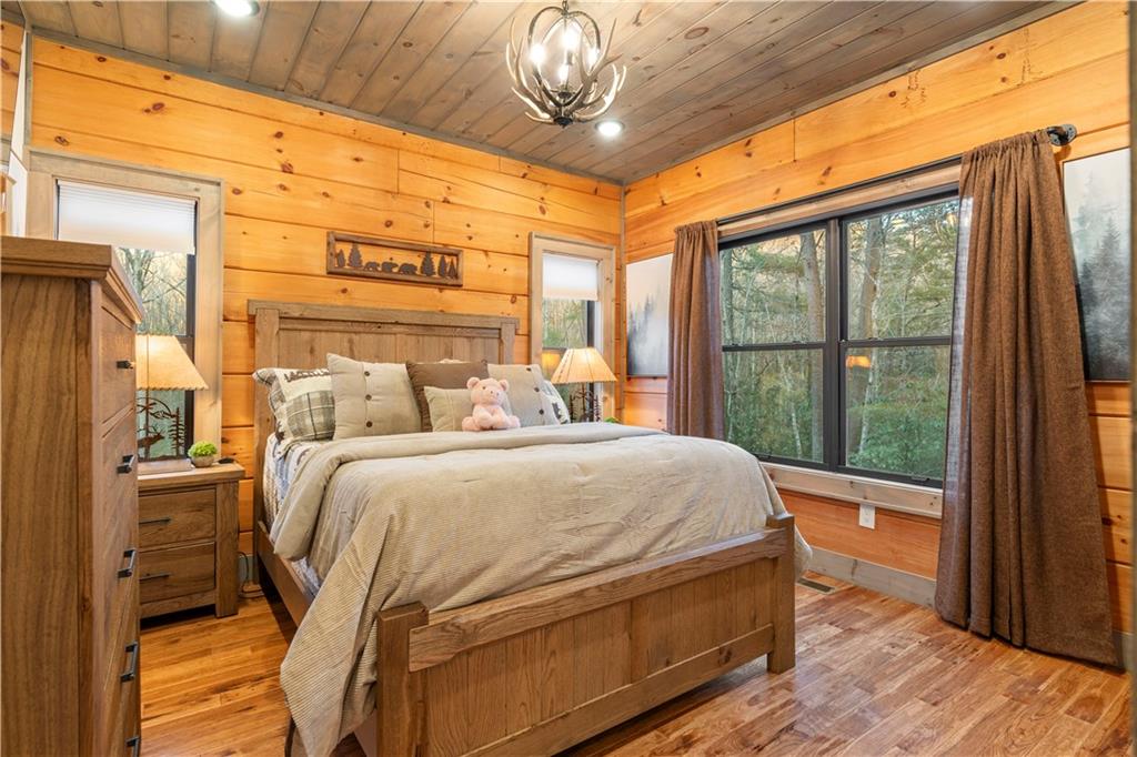 447 Pig Trail Cherry Log, GA 30522 - Photo 26 of 71 a bedroom with a bed and a window