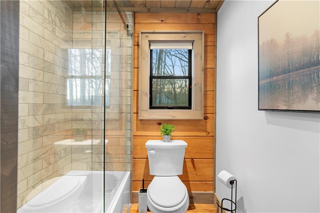 447 Pig Trail Cherry Log, GA 30522 - Photo 30 of 71 a bathroom with a toilet a sink and a shower