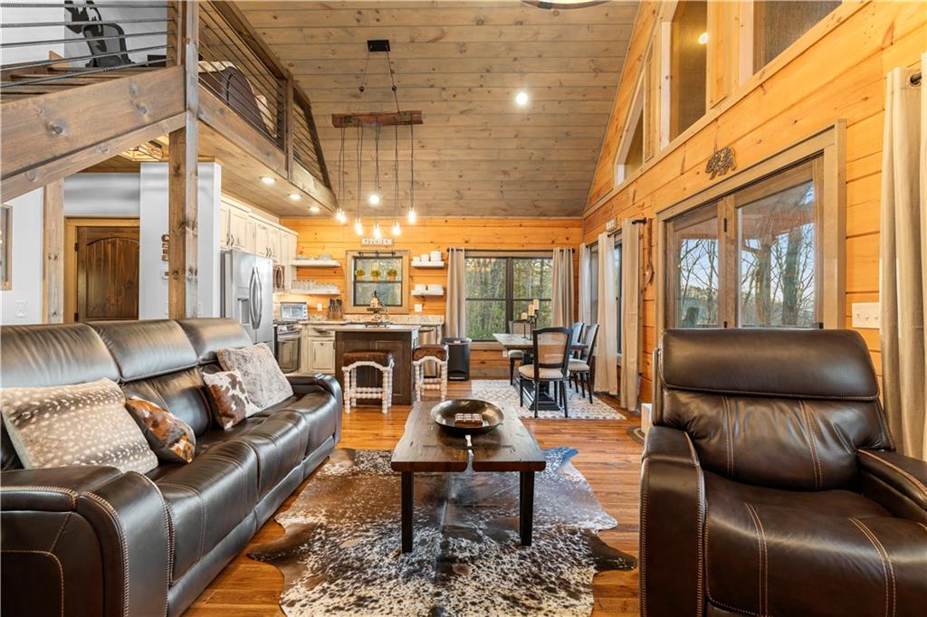 447 Pig Trail Cherry Log, GA 30522 - Photo 34 of 71 a living room with furniture and a table