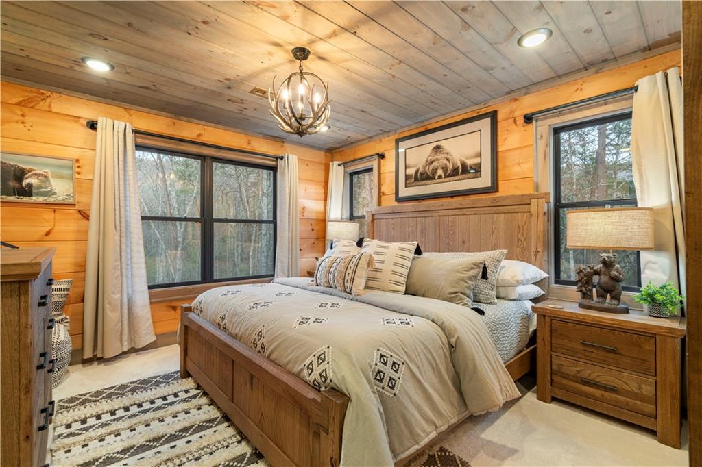 447 Pig Trail Cherry Log, GA 30522 - Photo 39 of 71 a bedroom with a bed and a window