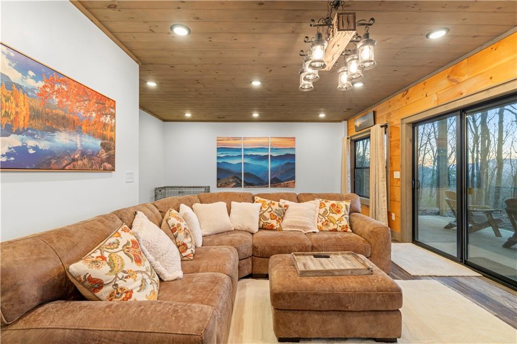 447 Pig Trail Cherry Log, GA 30522 - Photo 46 of 71 a living room with furniture and a large window