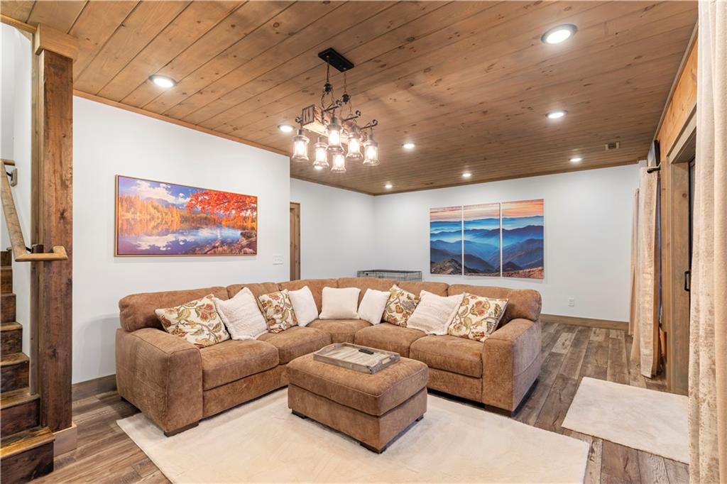 447 Pig Trail Cherry Log, GA 30522 - Photo 47 of 71 a living room with furniture and a flat screen tv