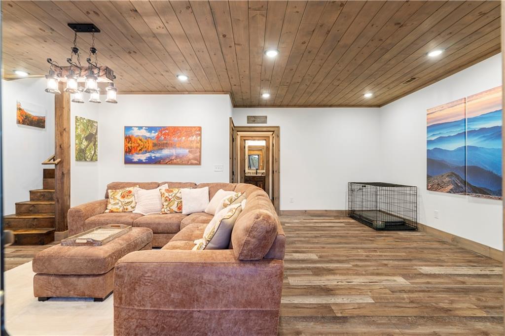 447 Pig Trail Cherry Log, GA 30522 - Photo 49 of 71 a living room with furniture and a chandelier