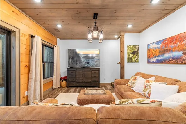 a view of a lush green hillside and houses