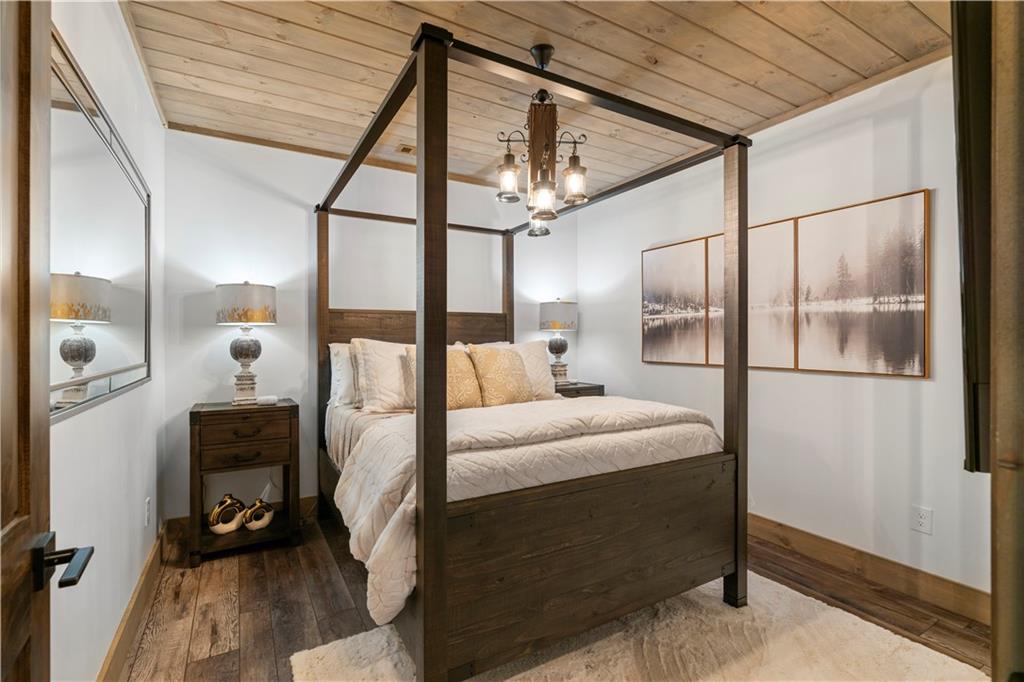 447 Pig Trail Cherry Log, GA 30522 - Photo 54 of 71 a bathroom with a sink a mirror and shower