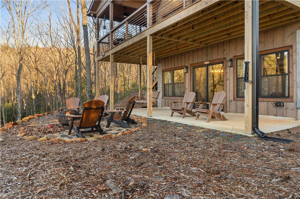 447 Pig Trail Cherry Log, GA 30522 - Photo 60 of 71 a view of a backyard with sitting area and furniture
