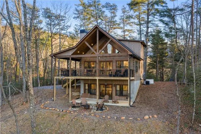 a view of a patio with table and chairs and wooden floor