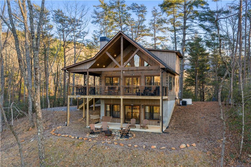 447 Pig Trail Cherry Log, GA 30522 - Photo 8 of 71 a front view of a house with garden