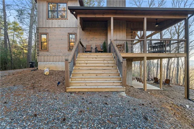 a view of a room with lots of furniture and wooden floor