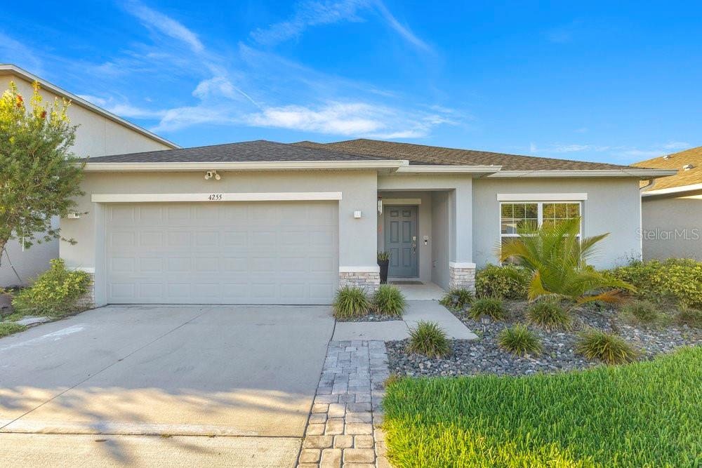 4255 Southern Vista Loop St. Cloud, FL 34772 - Photo 1 of 34 a front view of house with yard