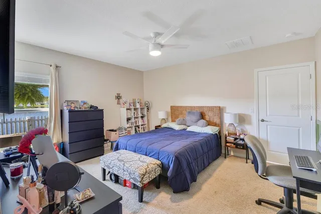 a bedroom with a bed and furniture