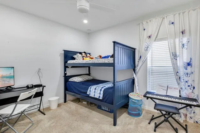 a bedroom with furniture and a window