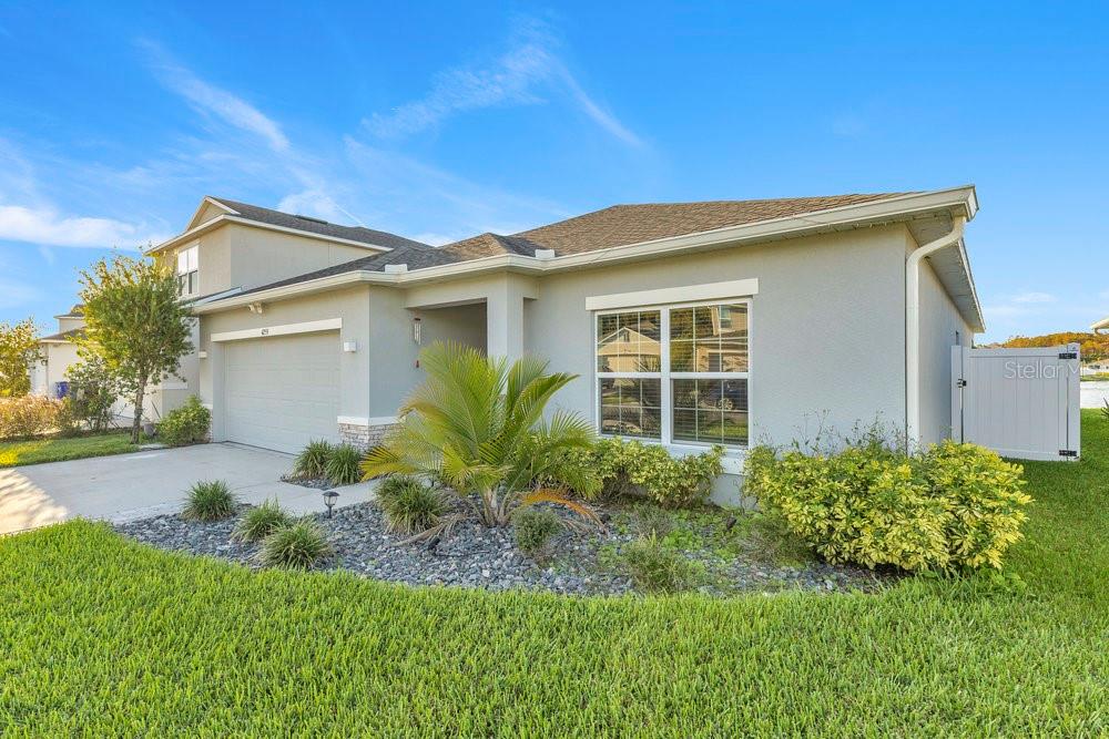 4255 Southern Vista Loop St. Cloud, FL 34772 - Photo 2 of 34 a front view of a house with a yard